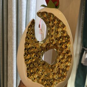 Modern Vases in Uganda in gold and white with flowers